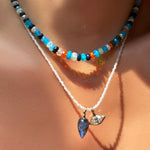 jaipur jazz faceted opal necklace layered over a moonstone slim gemstone necklace with labradorite drop charm and molten solitaire charm with marquise diamond on the neck.