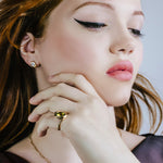Green tourmaline molten knot ring on a model.