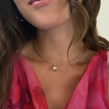 14K Gold Wire Choker Necklace styled with the Molten Skull Charm styled on a neck