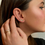 14k gold Full Pave Large Ripple Climber Earrings on an ear