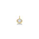 An AMANDA PEARL molten solitaire oval charm in 14K recycled yellow gold, featuring an ethical lab grown diamond sits on a neutral white background.  