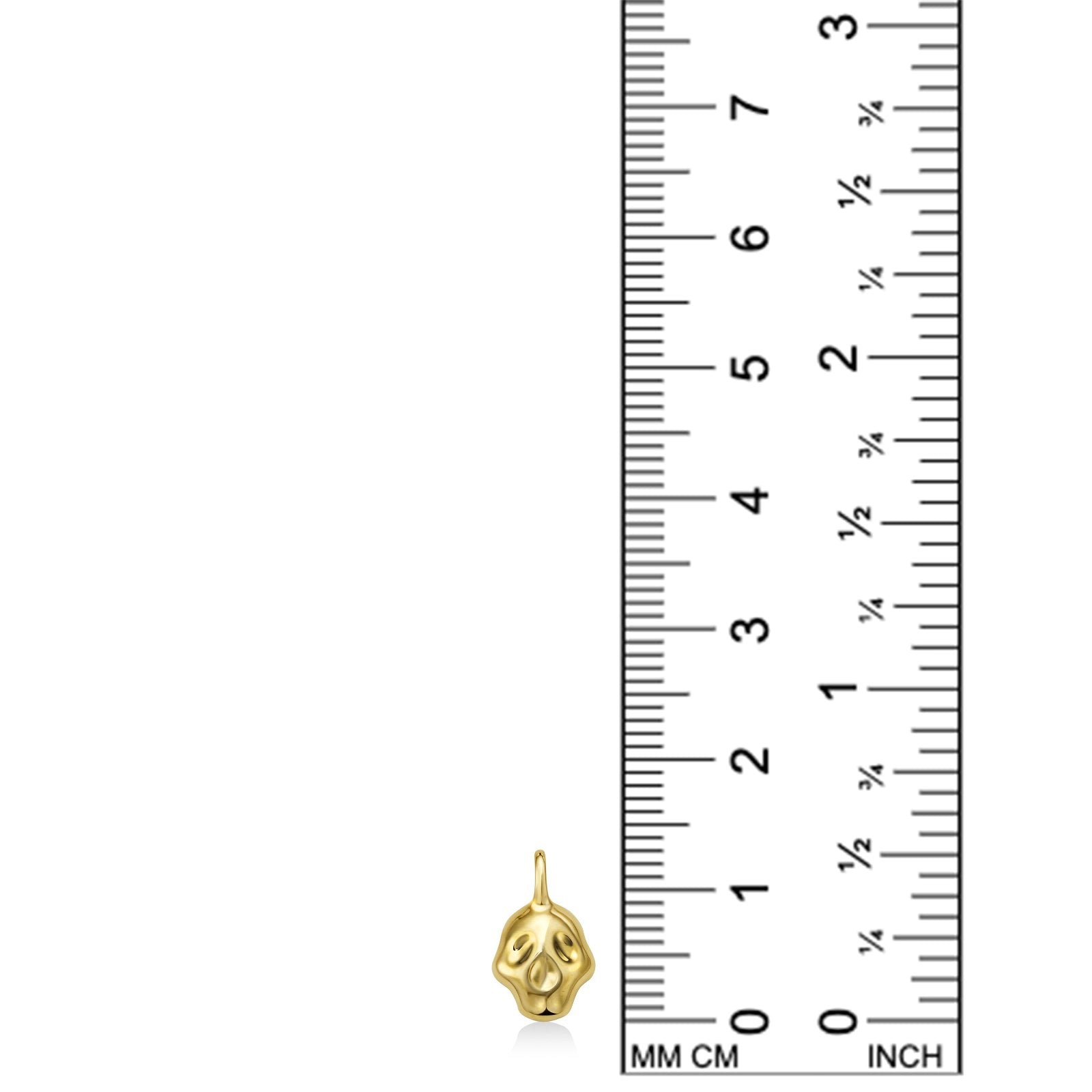 14K recycled Yellow Gold skull charm on white background with ruler measuring, 14mm tall