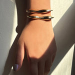 14k recycled Gold Molten Cuff Bracelet, pictured together on a wrist