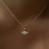 14K Recycled Gold Molten Solitaire Charm in Marquise layered on a gold wheat chain