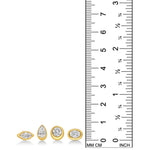 A ruler photo that compares the heights of the Molten solitaire studs in 14k yellow gold with diamond. 