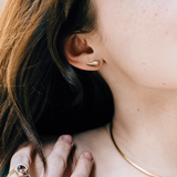 14K recycled gold tear drop shaped Molten Stud on an ear