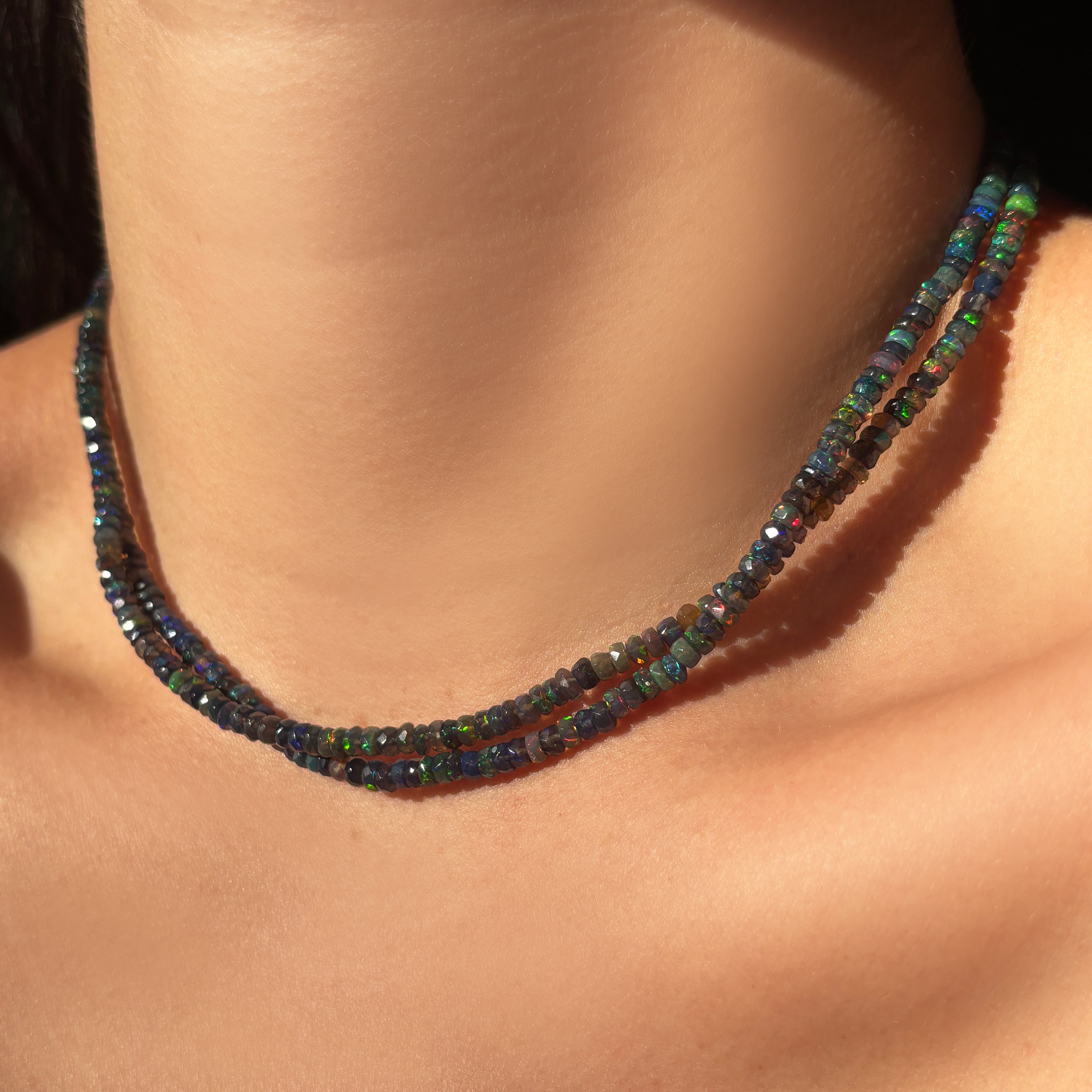 Small Black Faceted Opal Necklace layered together styled on a neck