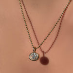 14K Recycled Gold Molten Solitaire Oval Charm styled on a Yellow Gold Bead Chain 