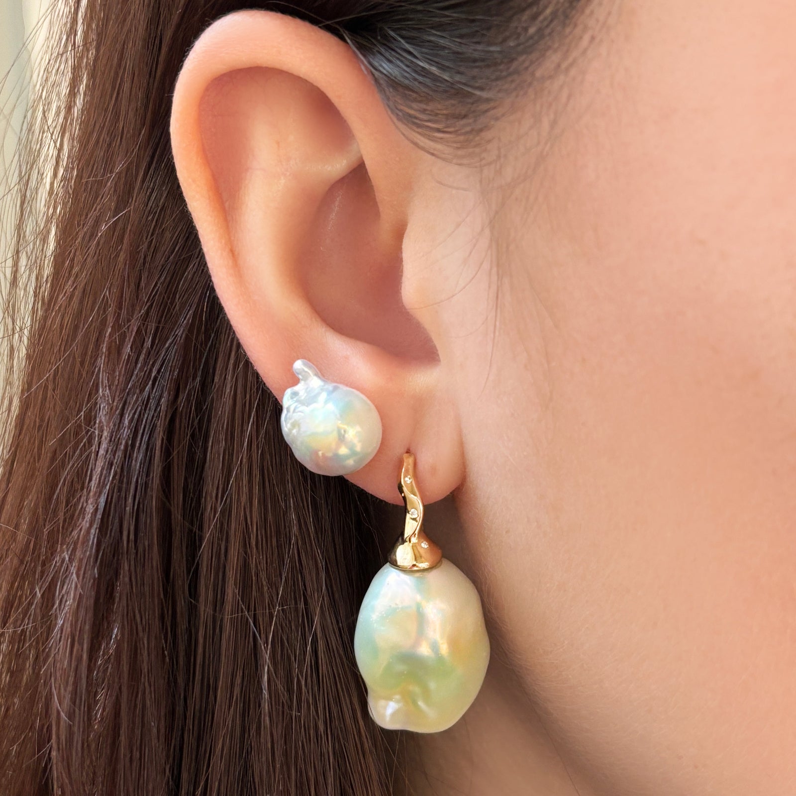 Baroque Pearl Drop Earring with 14K recycled gold ripple bale with lab grown diamond pave detail styled with a Baroque Pearl Stud on an ear