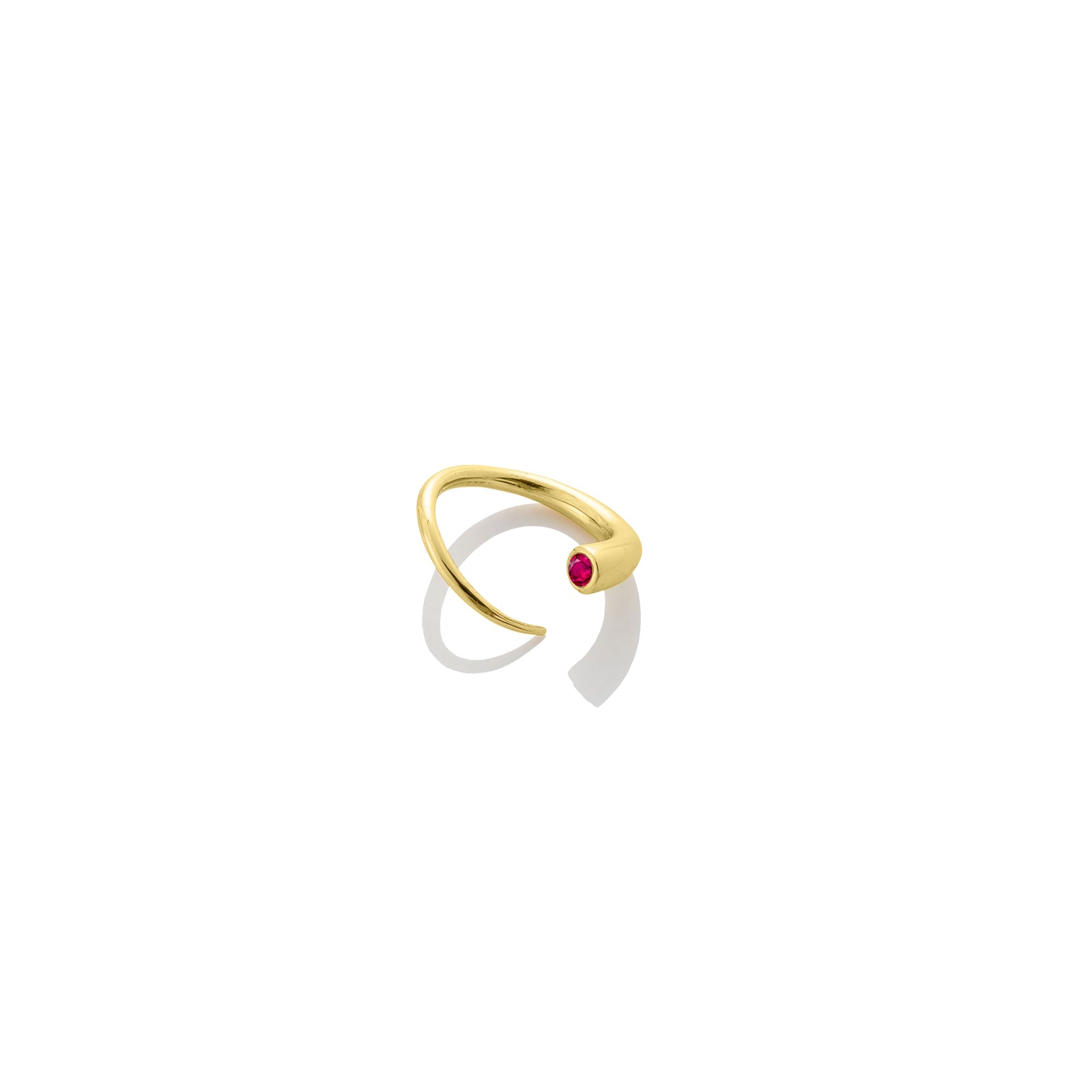 14k recycled yellow gold Quill Bypass Ring with bezel set Ruby on a white background.