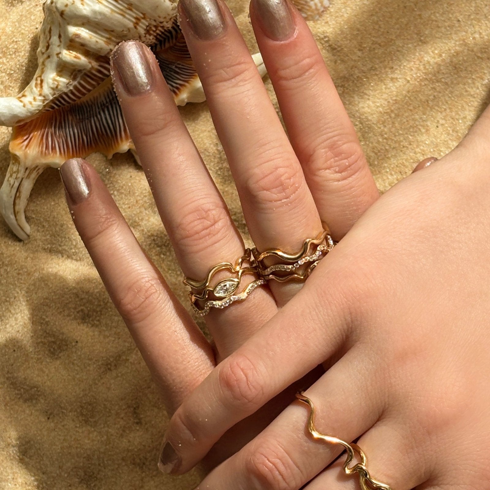 14K Recycled Gold Ripple with marquise stacked with Full Pavé and Plain Ripple Ring on a hand