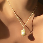 14k Recycled Yellow Gold Ripple Bale on a Large Baroque Pearl Charm styled on a Pearl Slim Gemstone Necklace