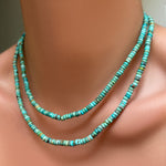 AMANDA PEARL turquoise rondelle necklaces with sterling silver evolution clasps layered on a model's neck.