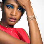 14k gold Plain Ripple Cuff Bracelet styled on a wrist with full pavé and demi pavé ripple cuff bracelets