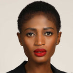 14k recycled gold Curved Quill Climber Earrings seen from straight on, on a model.